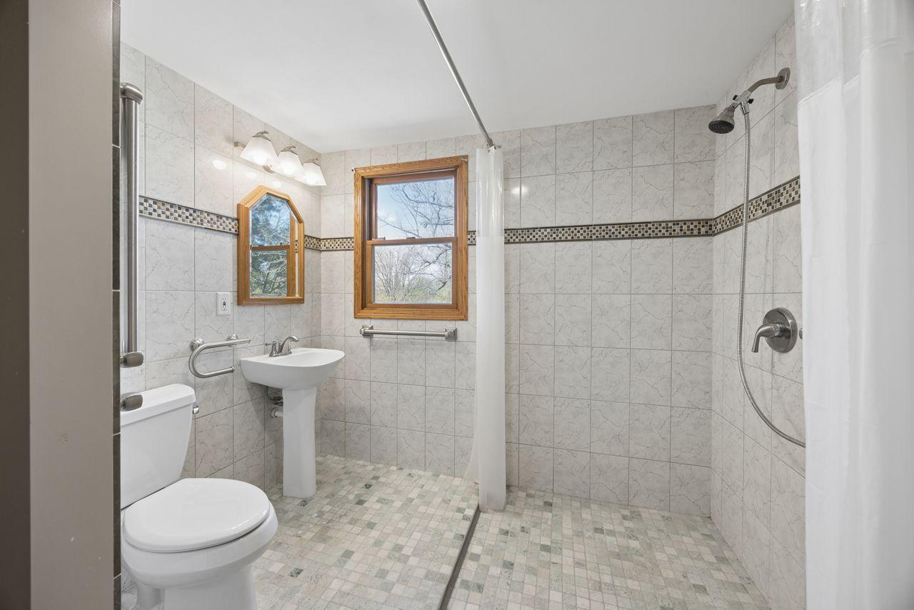 Main level bathroom with walkthrough to bedoom 2