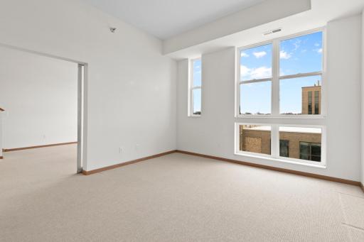 Main level bedroom has plenty of space for large furniture.