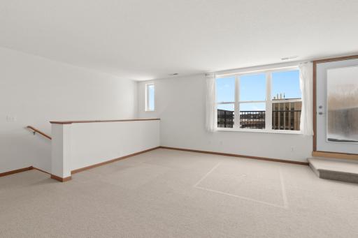 Upper level of condo and door to the deck.