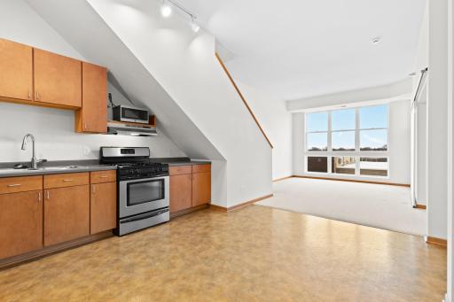 Kitchen opens to living space