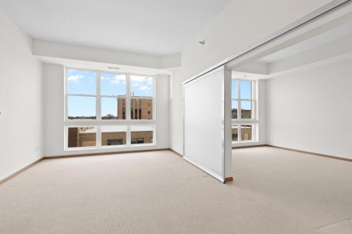 Barn door separates the main floor bedroom from the livingroom