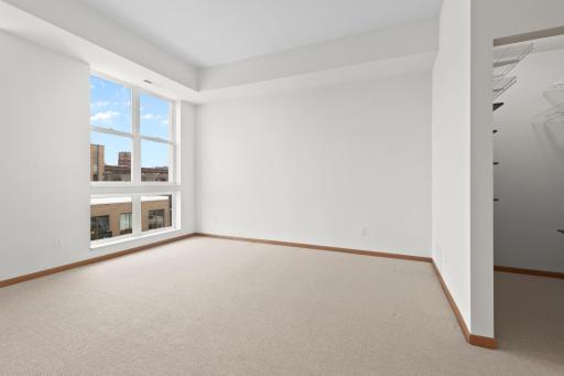 Walk in closet in main level bedroom