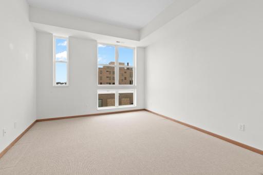 Large main level bedroom has a walk in closet and easy access to full bath.