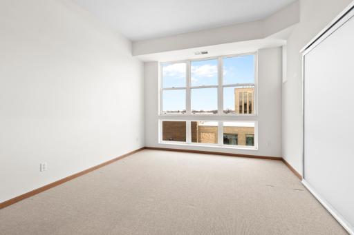 Living room has plenty of light from the large windows