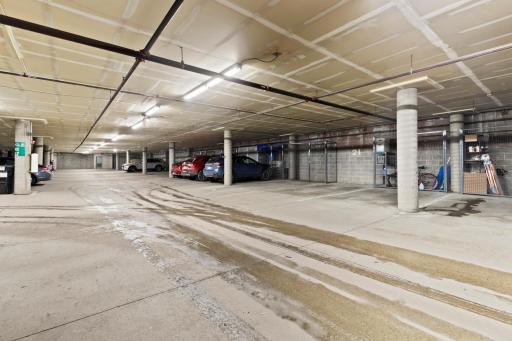 Designated spot in heated garage with storage right in front of parking spot.