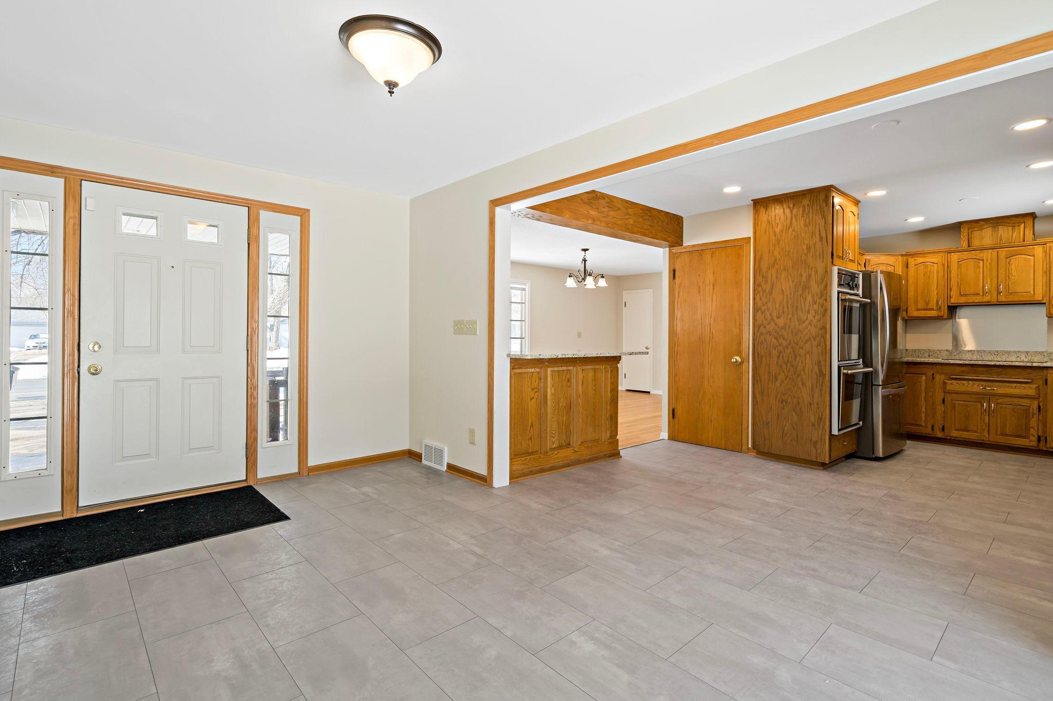 Entry way, views of the dining, kitchen and living room