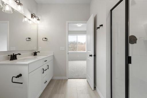 Private primary ownerâs bath featuring thoughtful design and quality finishes.
