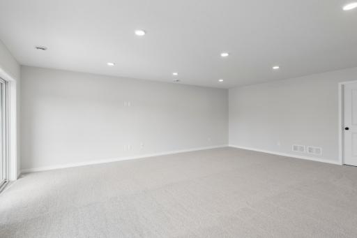 Different perspective highlighting the spacious finished basement.