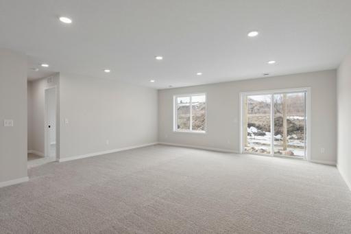 Beautifully finished walk-out basement providing versatile space and easy access to the backyard.