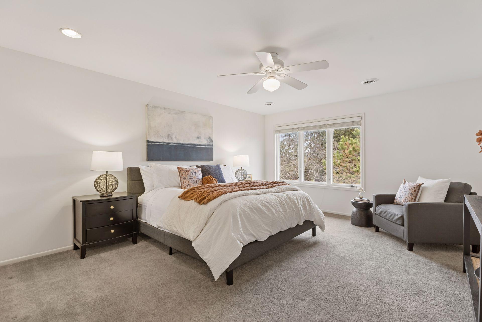 Freshly painted large primary suite on the upper level.