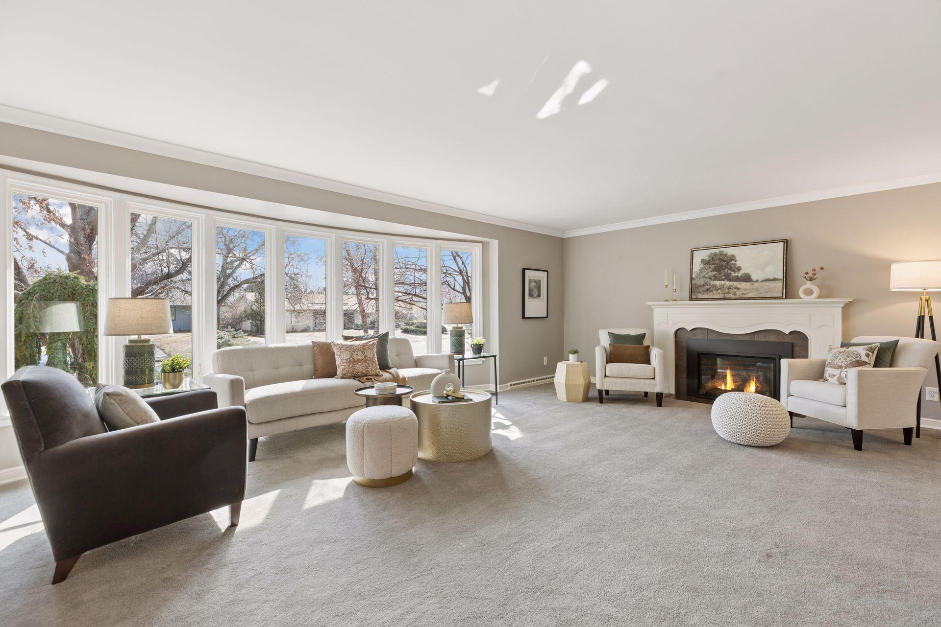 Gracious living room with a gas fireplace. So much space to gather with family or entertain!