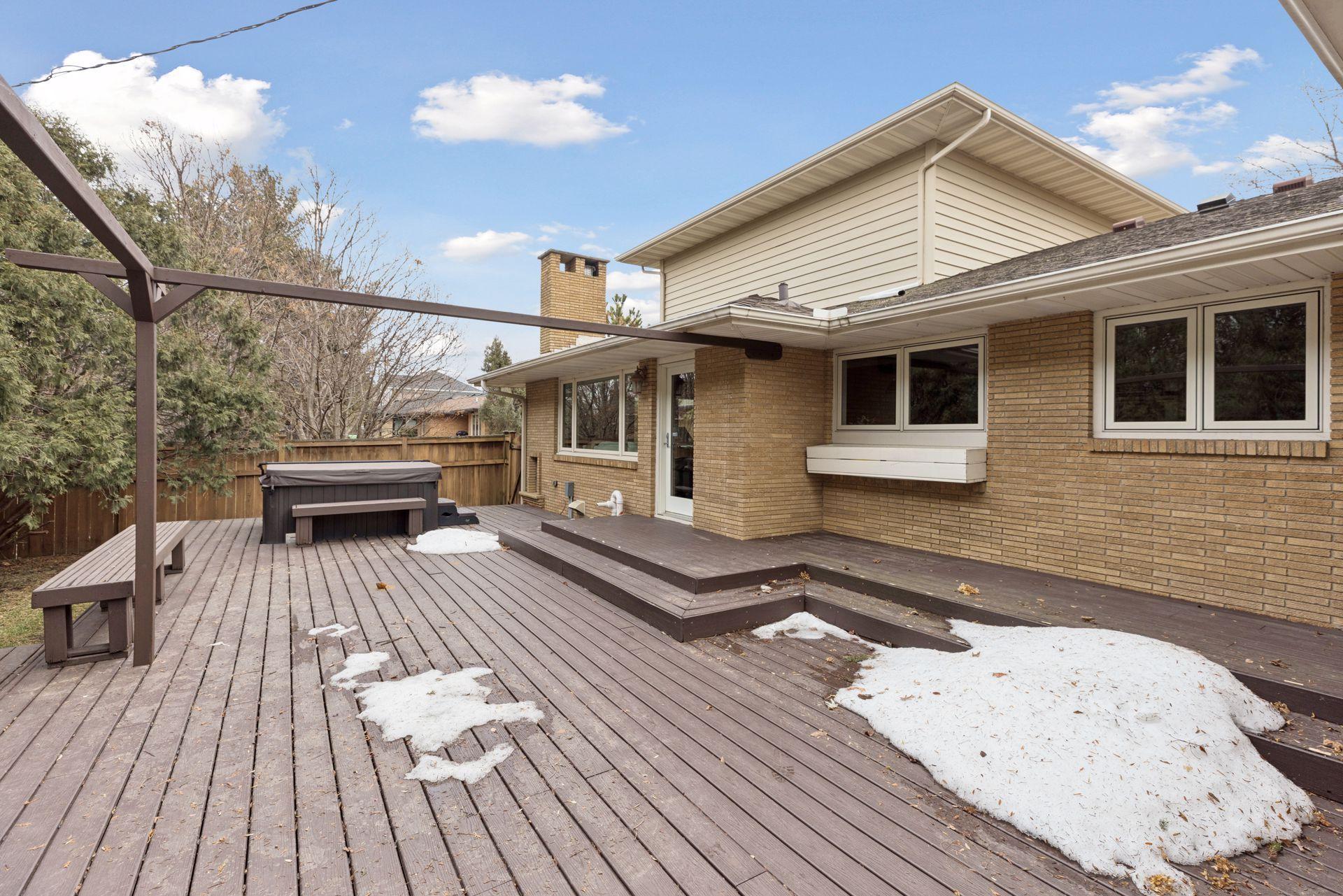 Relish the seasons in the private, fenced-in backyard, which features a large maintenance-free deck & added hot tub.