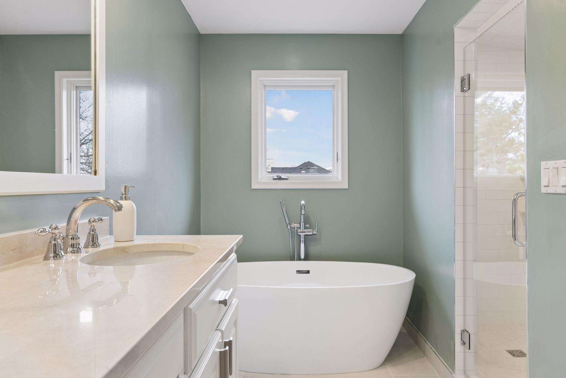 Featuring a newly installed free-standing tub and a separate shower.