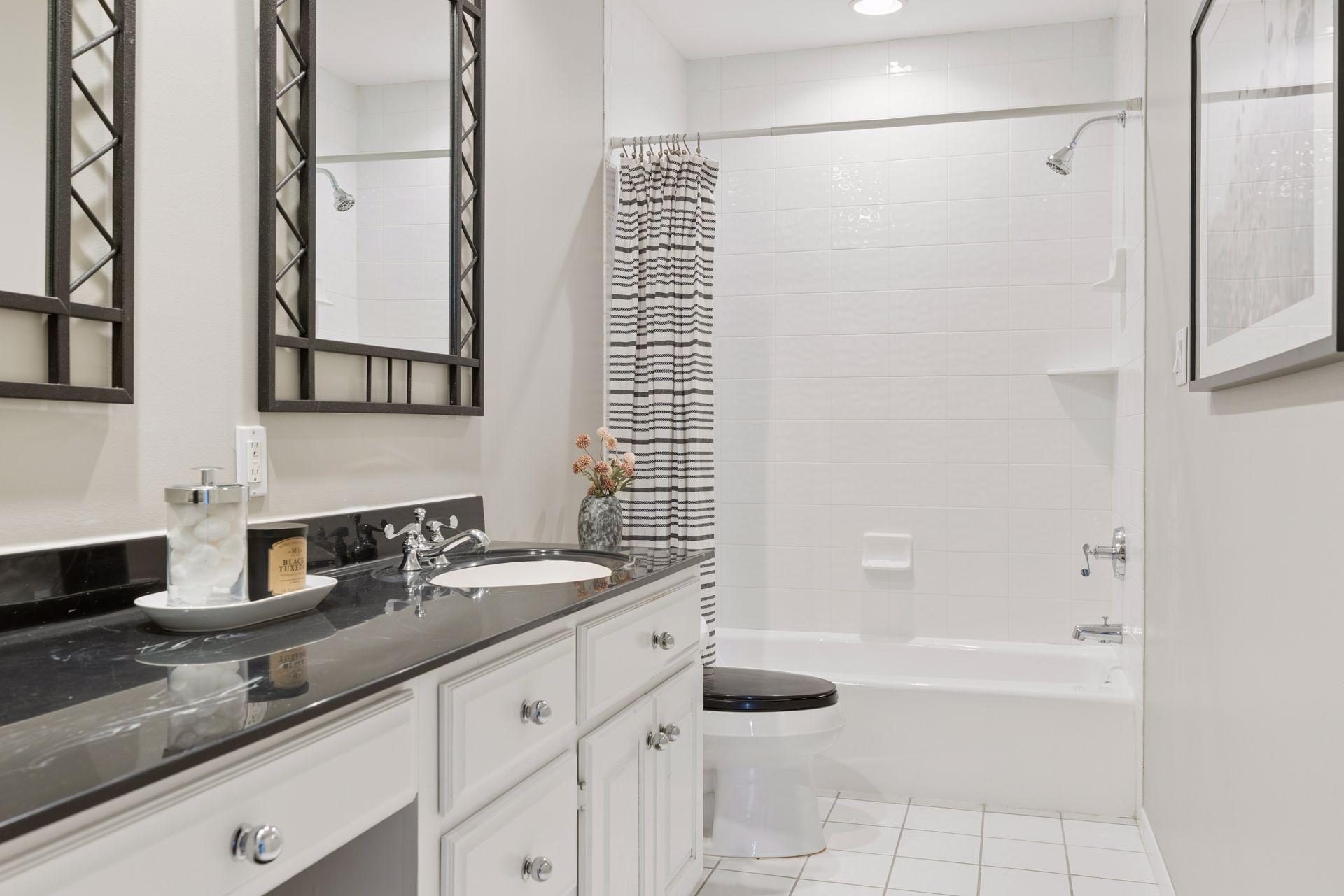 Modern & newly repainted full bathroom on the upper level.