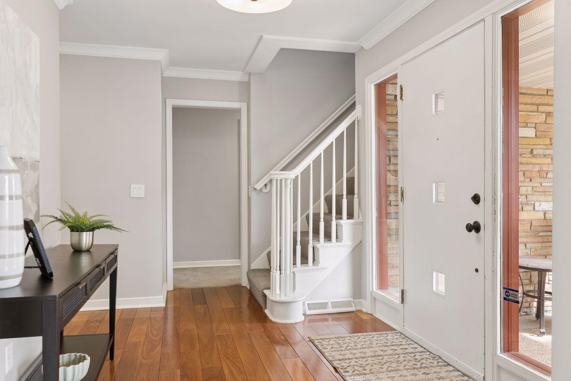 The front foyer leads to the main-level bedrooms & baths.