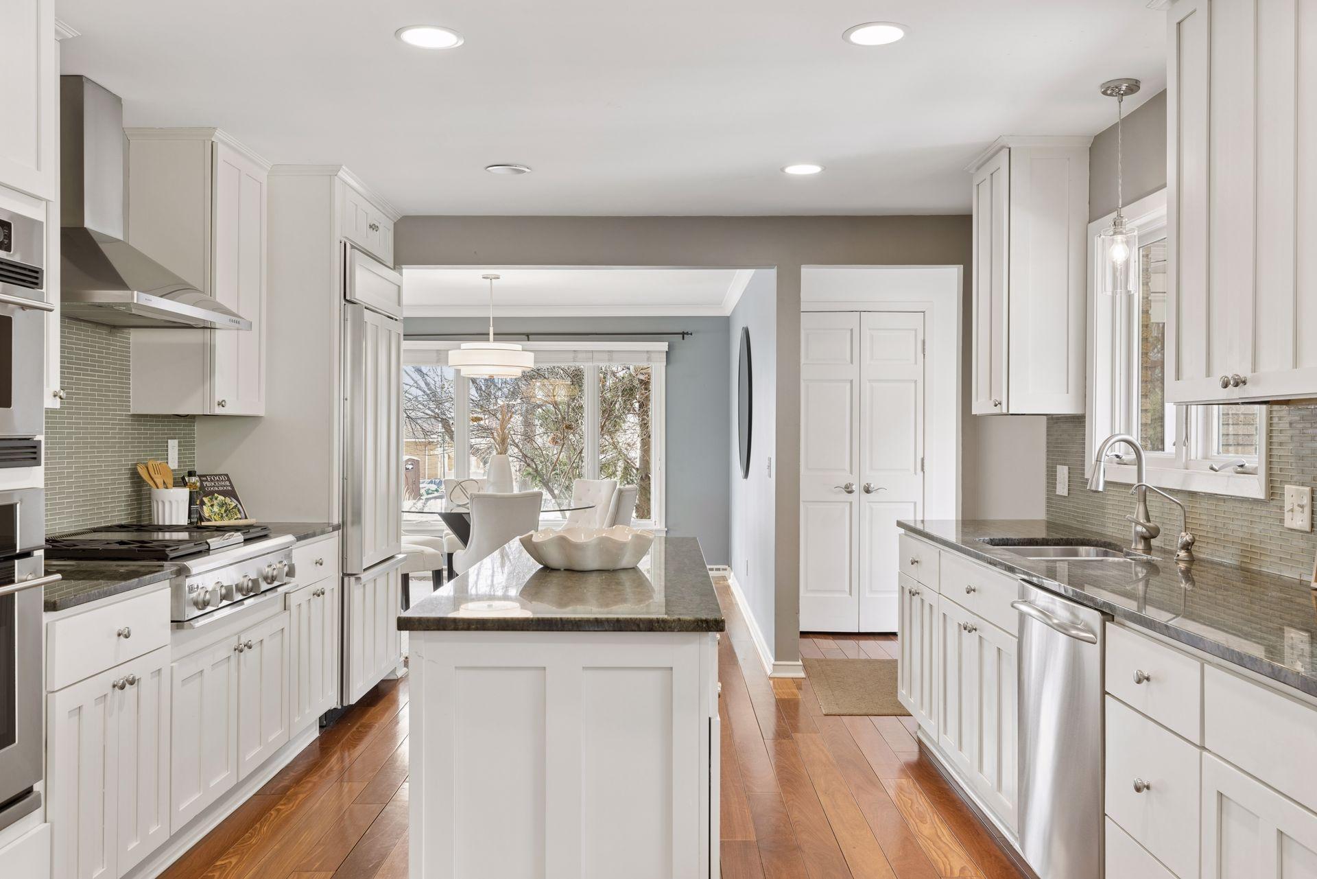 Special features in the kitchen include granite countertops, a water filtration system, and multiple wall ovens.