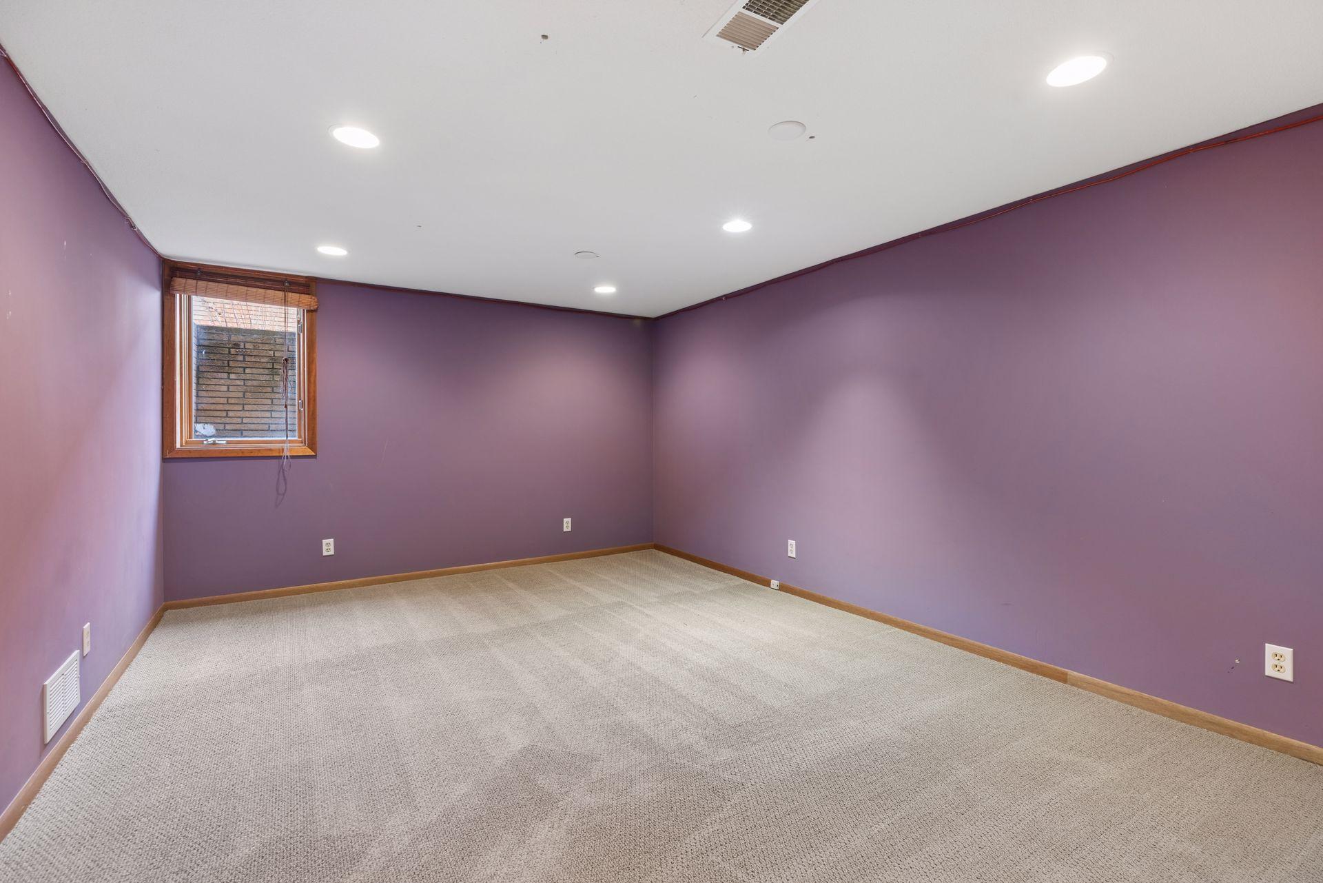 Fifth bedroom in the basement with an egress window.