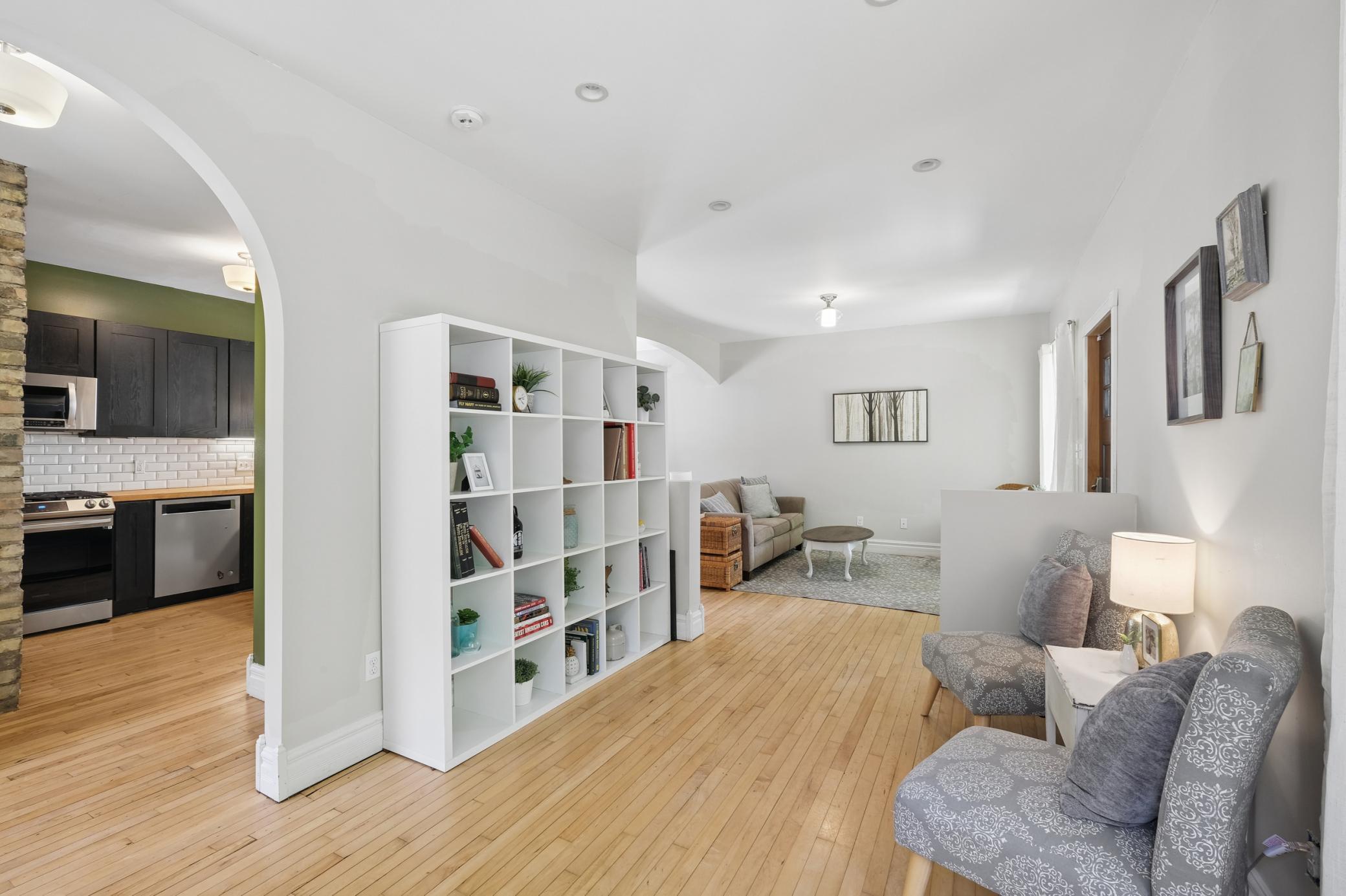 An open-concept layout highlights the home’s thoughtful renovations while preserving its original character,