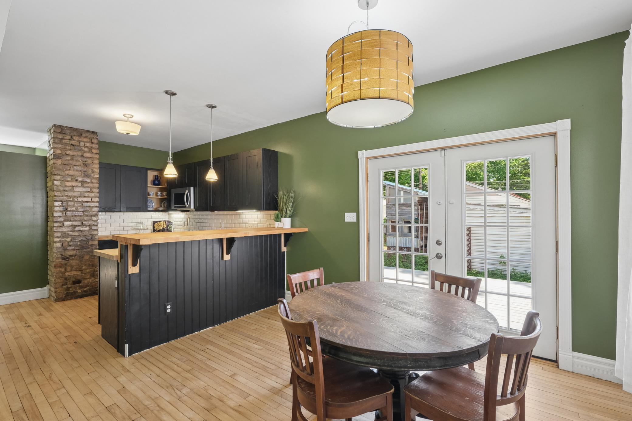 Kitchen is open to the dining room with french doors that lead to the back yard