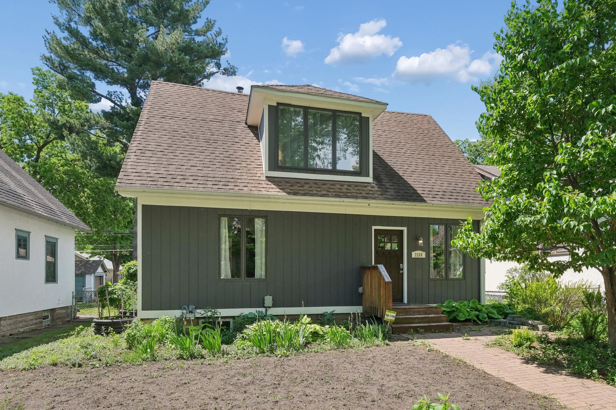 Welcome Home! Paver sidewalk and freshly tilled front yard