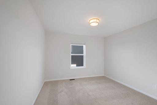 Second Bedroom (Photo of similar home - Colors and selections will vary)