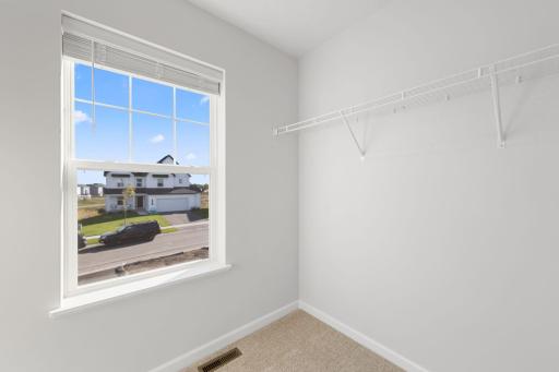 Owner's Closet (Photo of similar home - Colors and selections will vary)