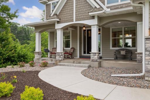 A welcoming front porch offering a front-row seat to the ever-changing colors of the seasons.