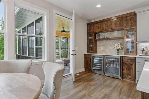 Two beverage fridges and extra storage make entertaining easyâperfect for crafting seasonal drinks steps from the screened porch.