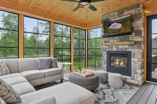 This luminous 3.5-season porch with a fireplace offers a year-round retreat and the homeâs most cherished gathering space.