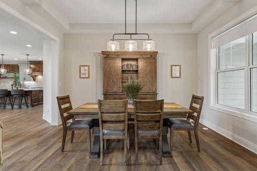 Just off the front entry, the formal dining room offers defined elegance while remaining seamlessly connected to the homeâs main gathering spaces.