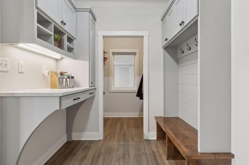 Just off the garage, this well-appointed mudroom offers the perfect drop zoneâwith built-ins for jackets, key storage, and a spacious closet beyond for everyday essentials.