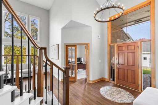 Welcoming warm entry, grand stair case, windows galore, 2 story ceilings create an impressive first impression
