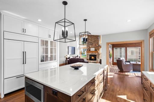 Stunning open concept with seamless flow to family room and screened porch.