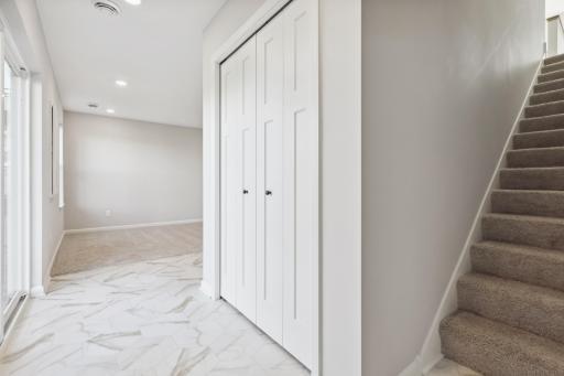 Garage Entry Foyer , closets for shoes and coats, flex room for entertaining or home office,