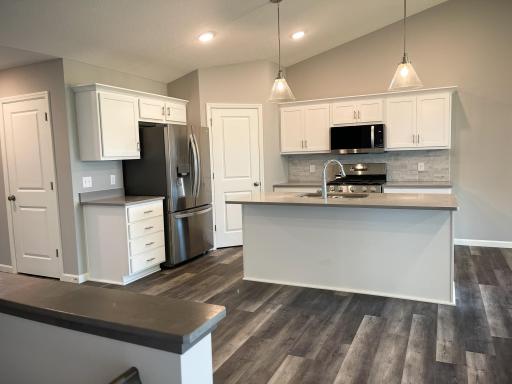 All photos of previously finished home of same floor plan