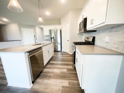 All photos of previously finished home of same floor plan