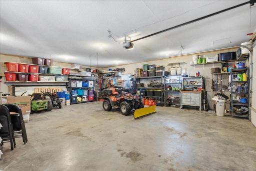 Detached garage measuring 28x32. In-floor heating and wood boiler heated!