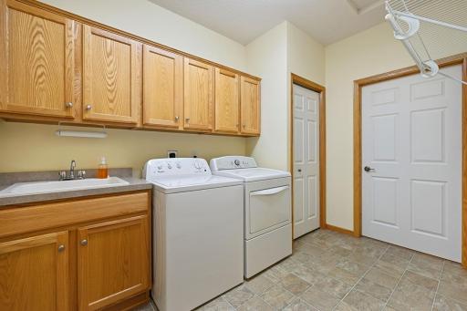 An entire room for laundry! It just off the garage entrance into the home. There is a closet in the laundry room and also one in the hallway just as you enter from the garage.