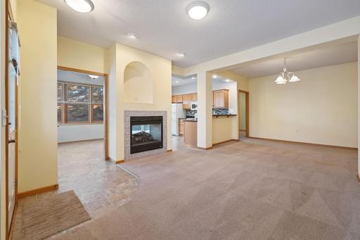 This corner unit townhome has light streaming in from two sides. The living/dining/kitchen area is open, for ease in entertaining, with a 2-way gas fireplace.