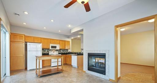 The kitchen walks out to the patio to make grilling super convenient. Adjacent to the kitchen is a 4-season sun porch.