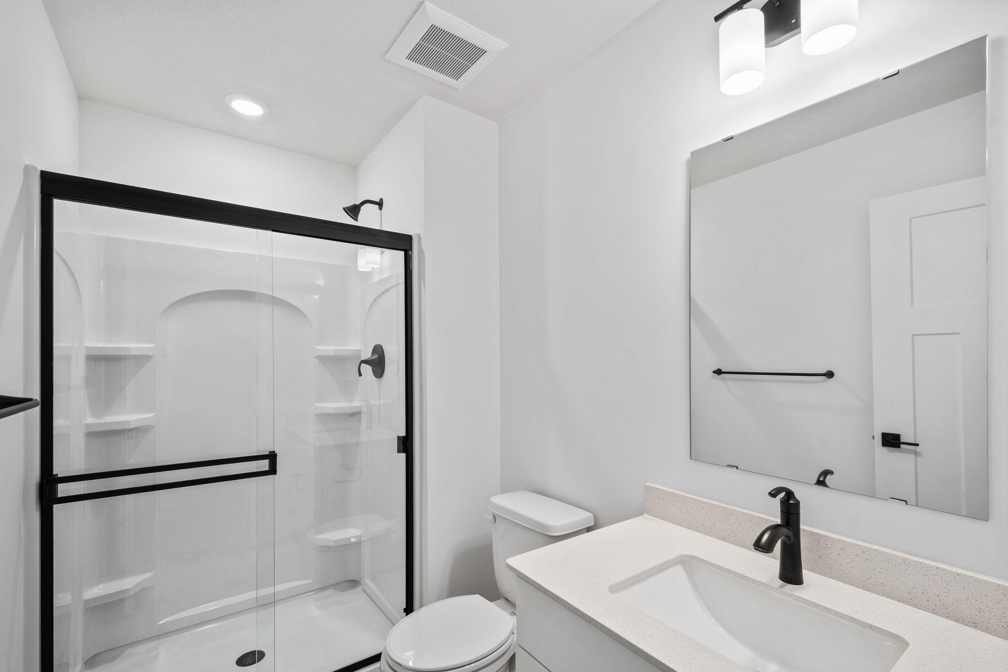 The en-suite bathroom within Bedroom 4.