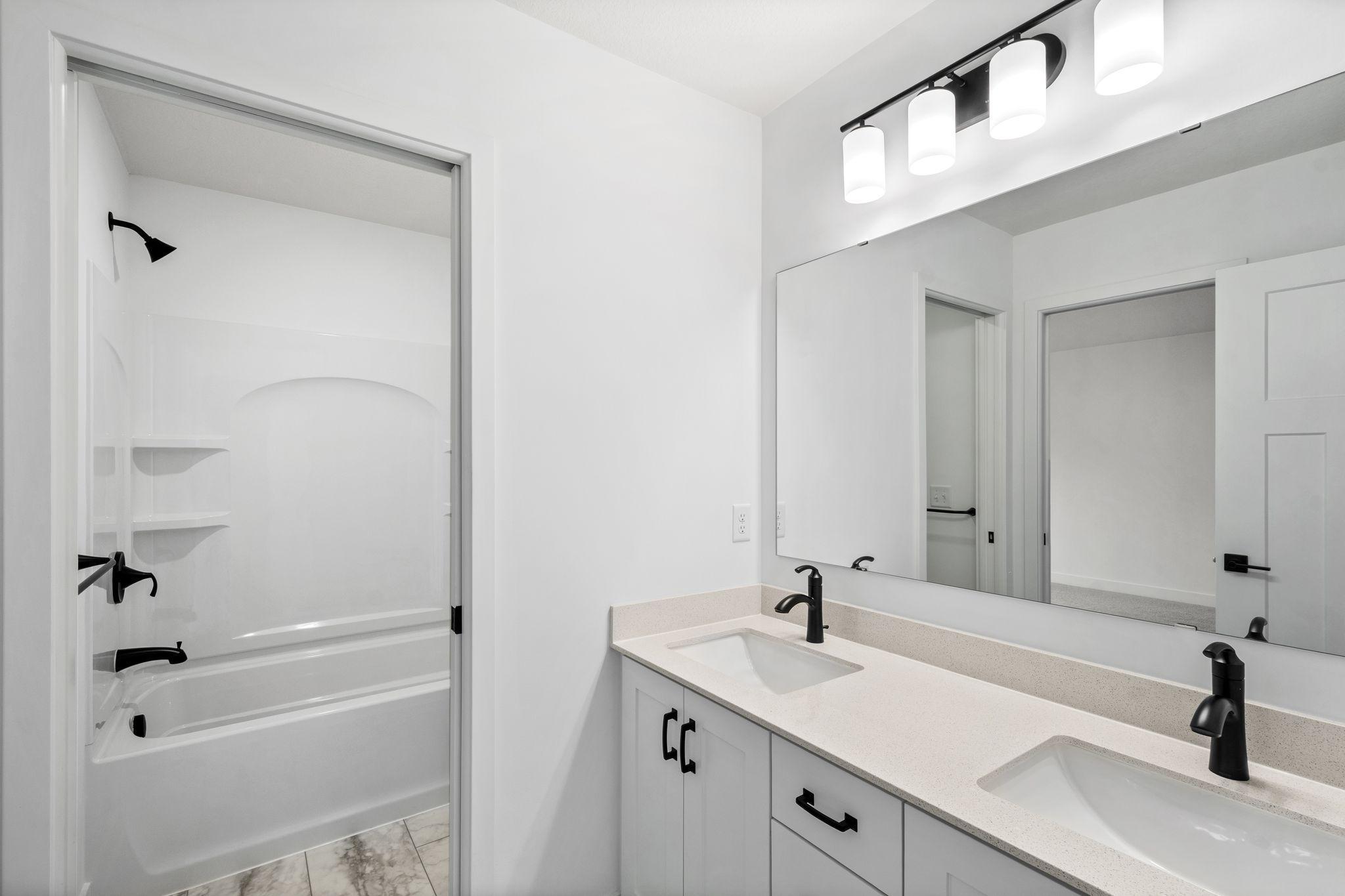 This bathroom provides Jack-and-Jill style access to two of the secondary bedrooms.