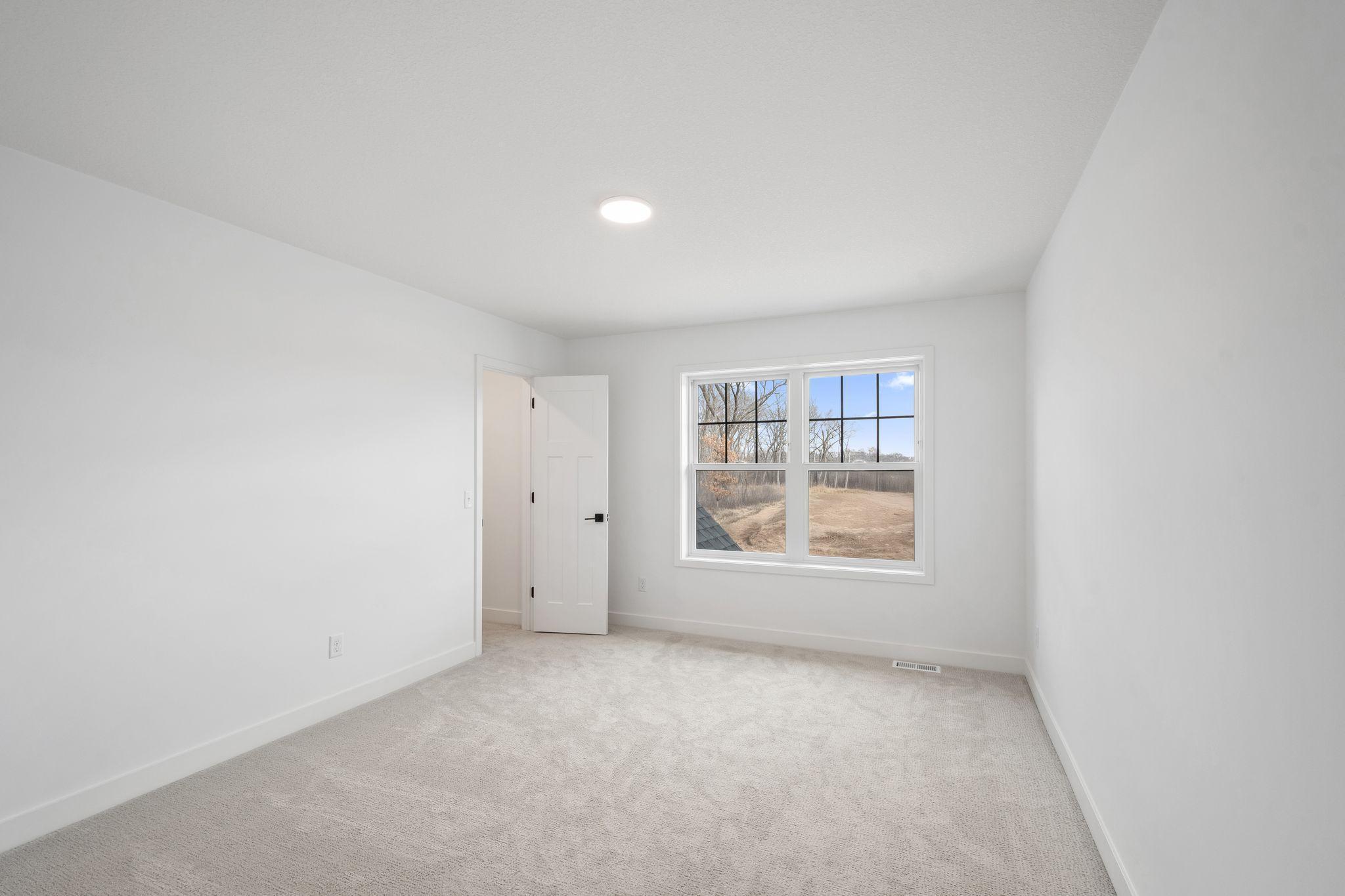 One of the three secondary bedrooms on the second level.