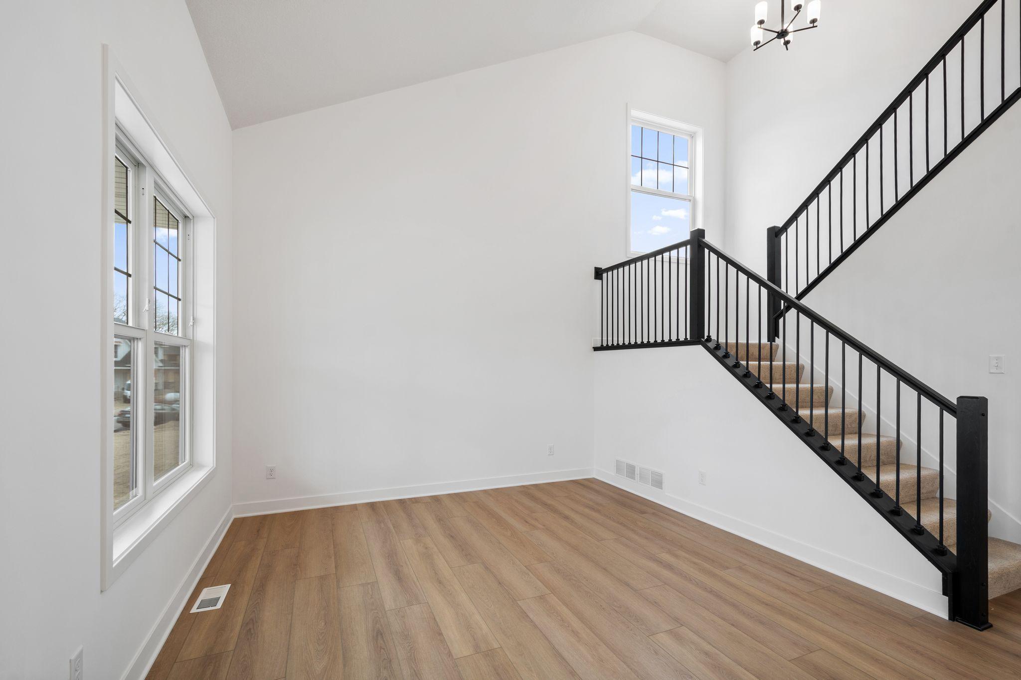 The a formal living room is also located off the entry, perfect for welcoming guests or curling up with a good book.