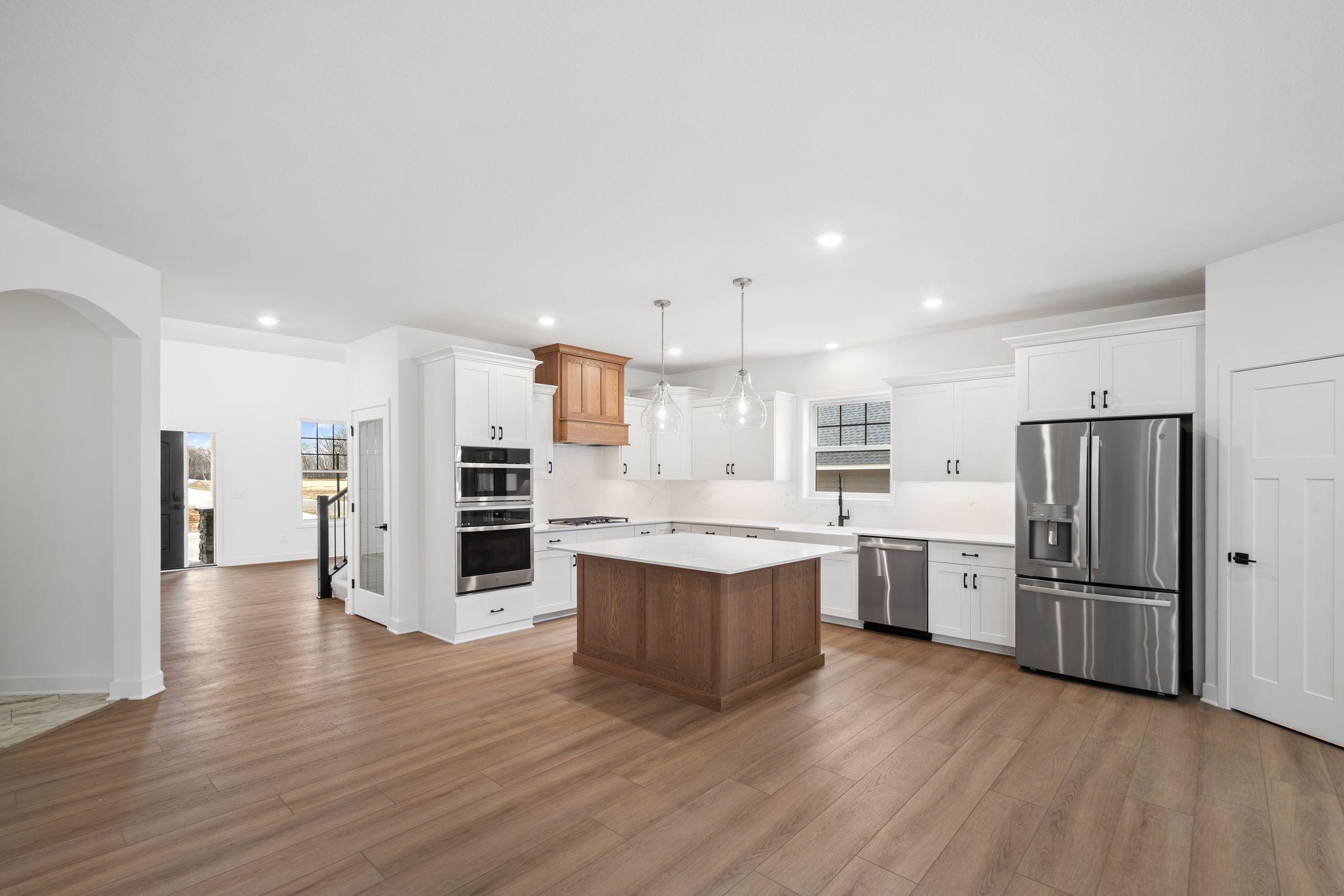 A breakfast room is tucked next to the kitchen, an ideal spot for family dinners or quick meals to start the day.