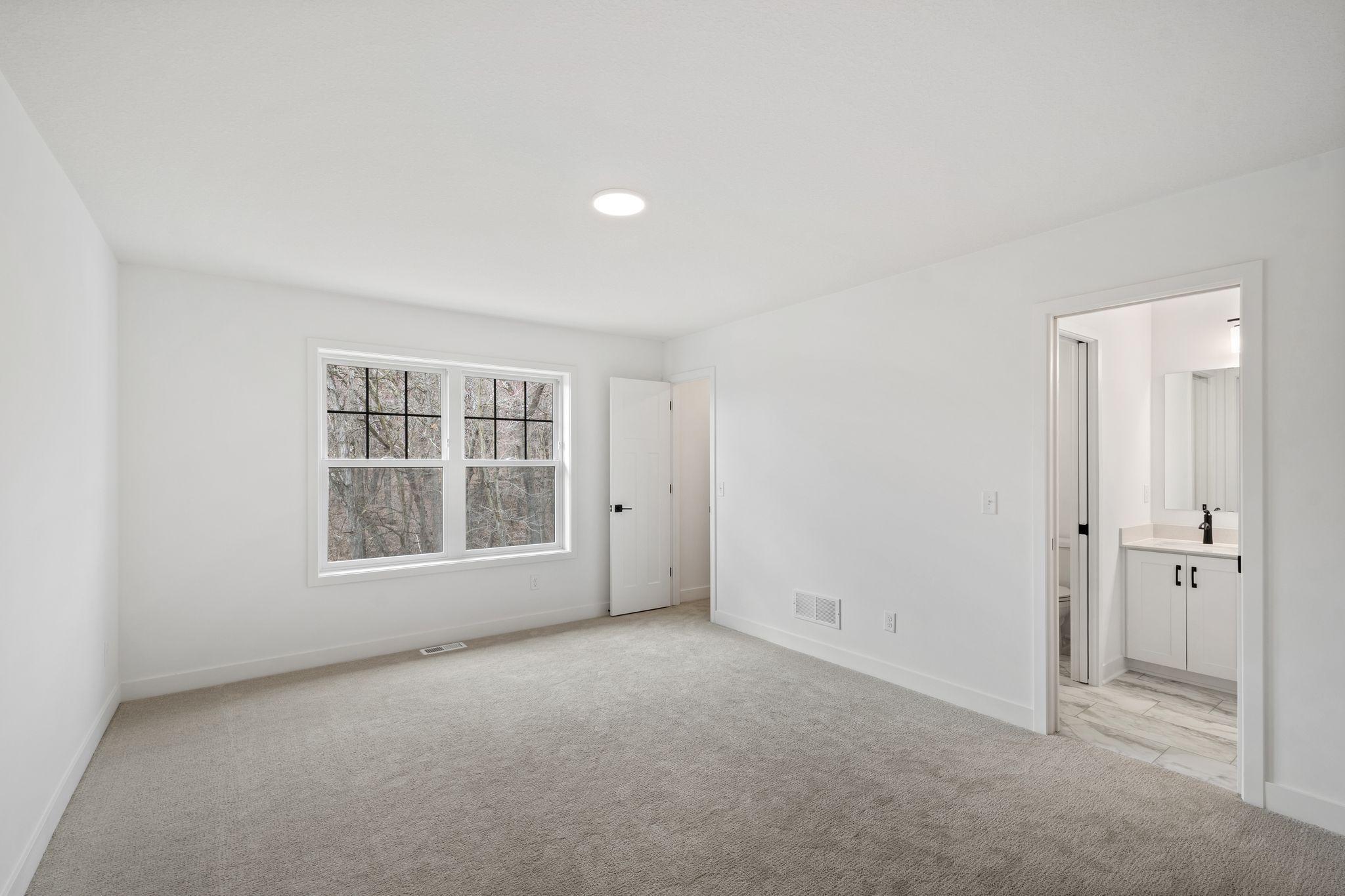 The largest of the secondary bedrooms, this room features plenty of space, a walk-in closet and a private en-suite bathroom.