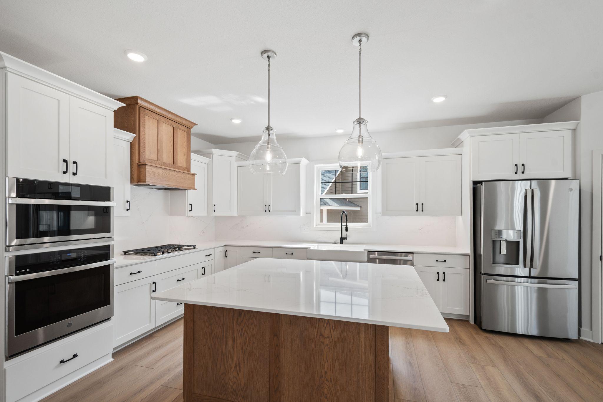 The spacious kitchen showcases an open layout, with plenty of countertop space, storage and a center island.