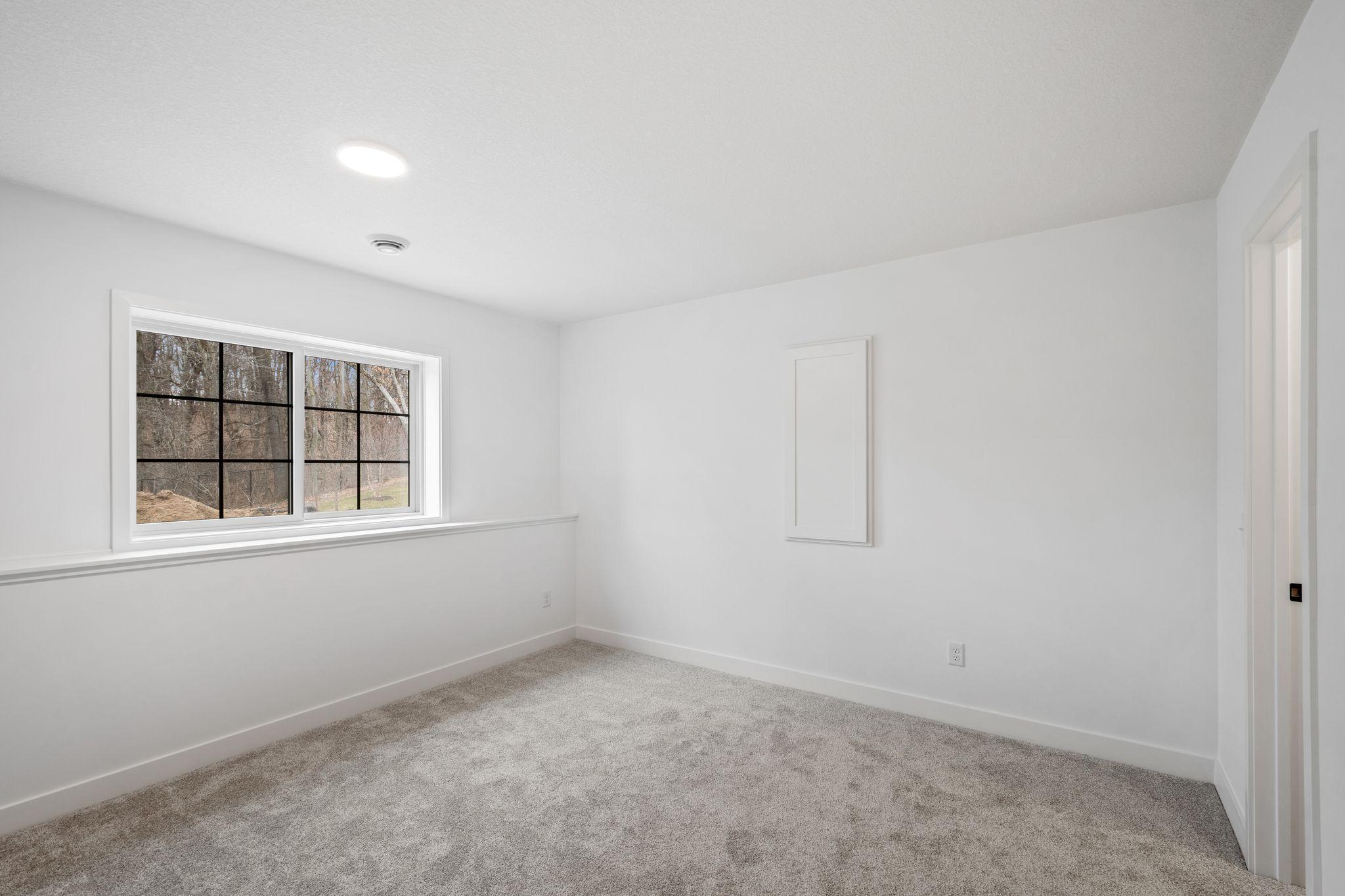 This lower level fifth bedroom is perfect for overnight guests