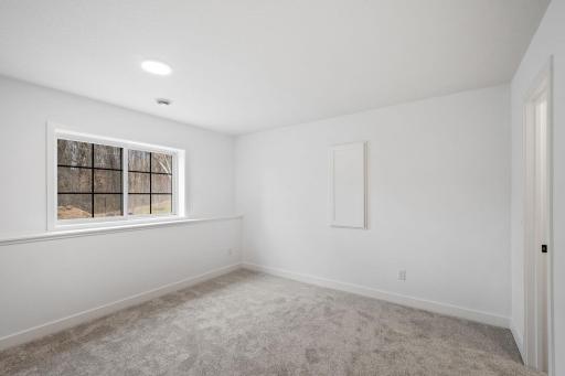 This lower level fifth bedroom is perfect for overnight guests