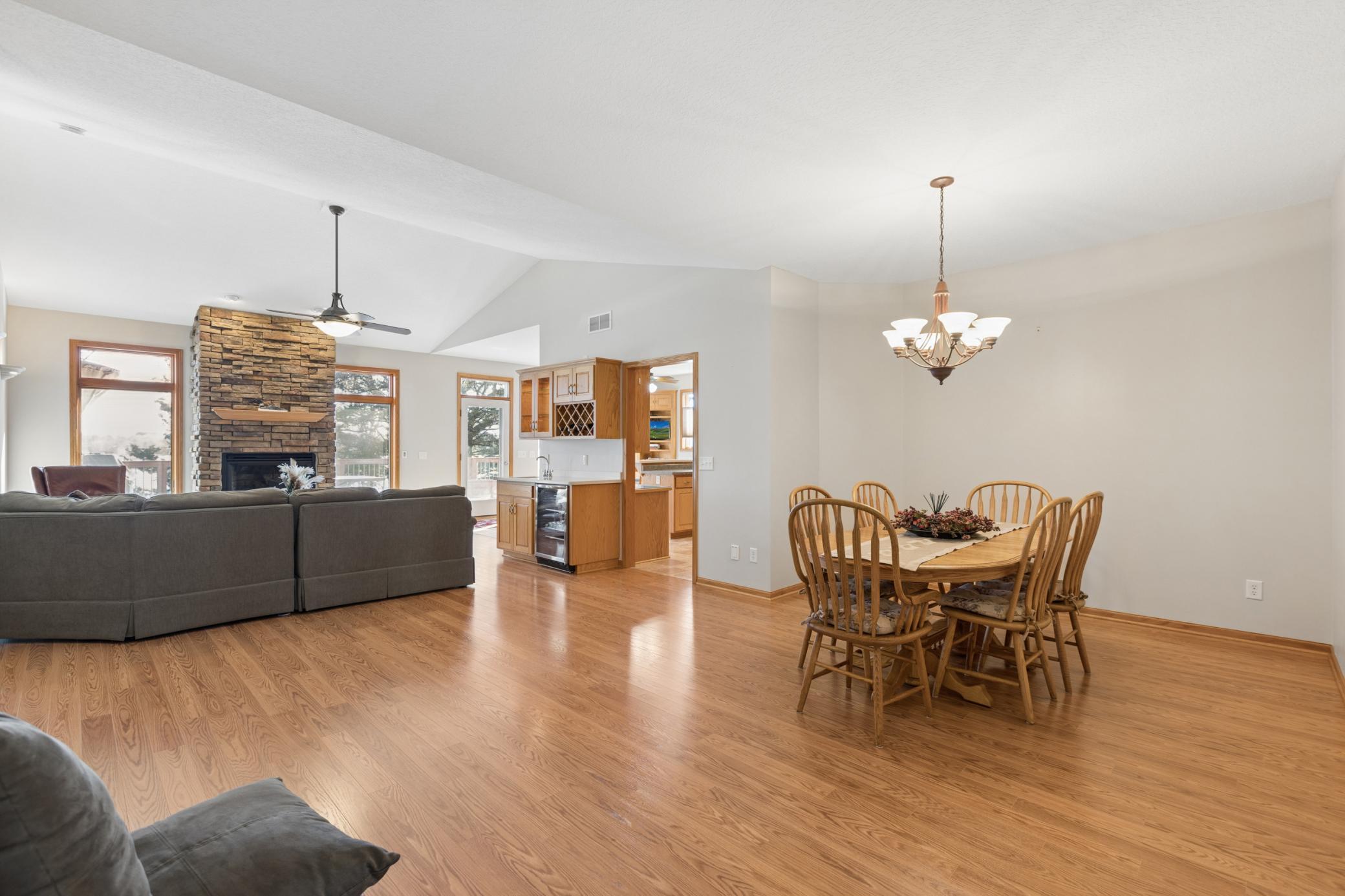 From the moment you enter this home your will appreciate the abundance of natural light from the oversized windows overlooking Cedar Lake and flooding the vaulted space with natural light.